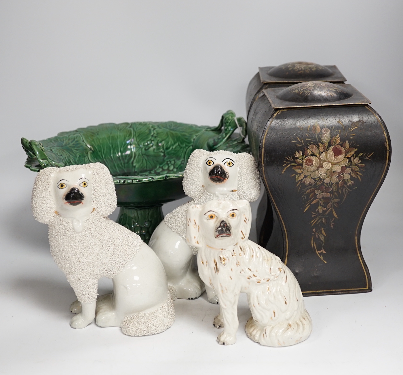 Three Staffordshire dogs, a green leaf pedestal dish and a pair of toleware vases, pedestal dish 30cm diameter